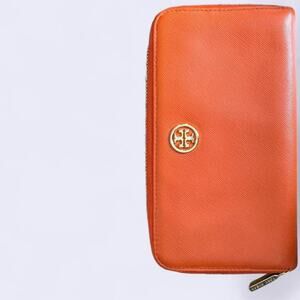 Orange tory burch full zip wallet